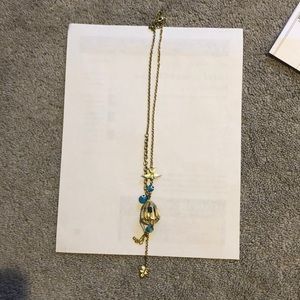 Gold long necklace with bird cage